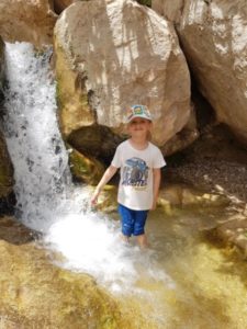 Raviv at a Waterfall